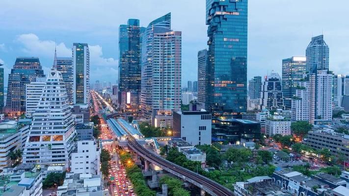 day-to-night-time-lapse-of-modern-building-in-business-zone-during-rush-hour-at-bangkok-thailand-video.jpg